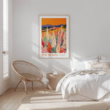 a bedroom with a large poster of a colorful floral landscape hanging on the wall above a bed with white bedding.