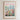 The image is a framed poster depicting a cityscape with a field of colorful flowers in the foreground.