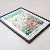 The image is a framed poster or print featuring a colorful illustration of a flower market in Mykonos, Greece.