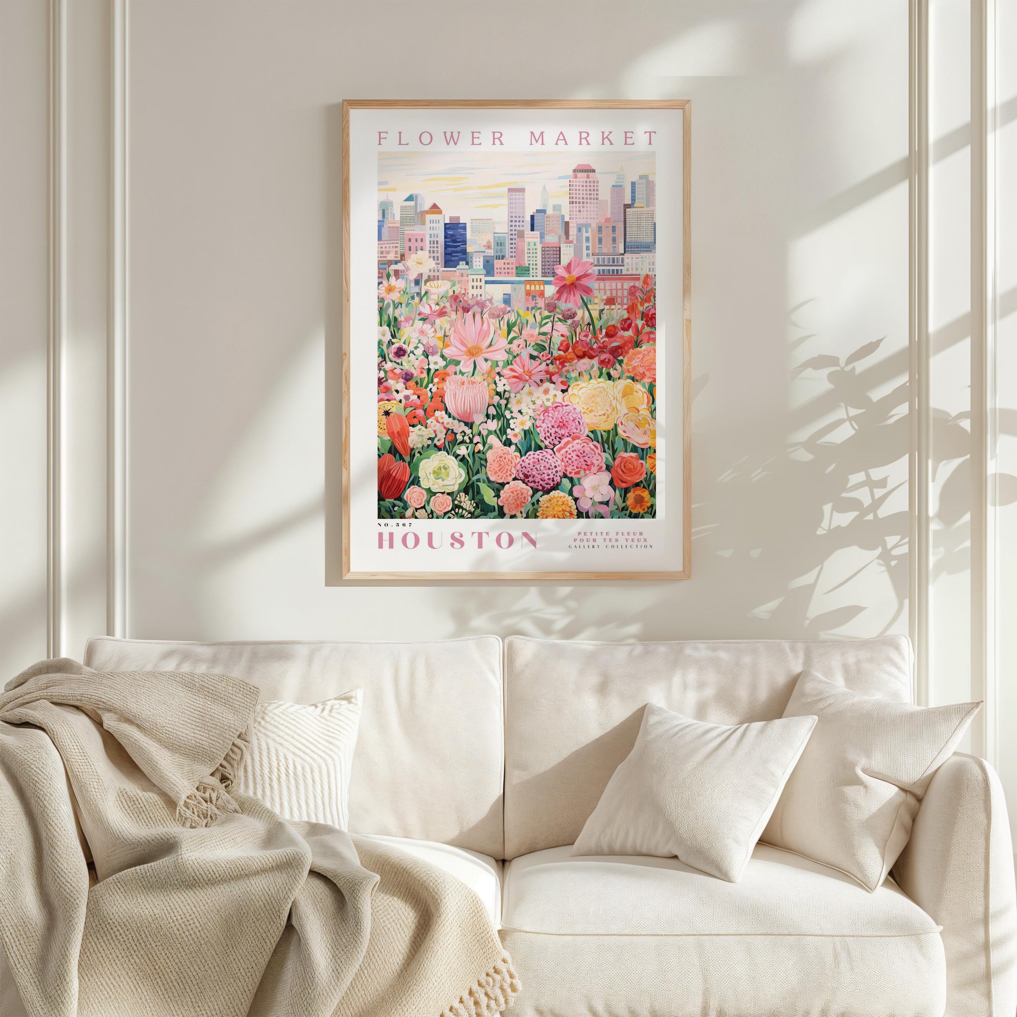a framed poster of a flower market in Houston, with a cityscape in the background.