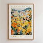 The image is a framed poster depicting a vibrant and colorful flower market in Arezzo, Italy.