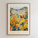 The image is a framed poster depicting a vibrant and colorful flower market in Arezzo, Italy.