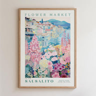 The image is a framed poster depicting a colorful and vibrant flower market in Sausalito, Italy.