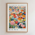 The image is a framed poster of a vibrant and colorful floral arrangement, depicting various flowers and plants in a lively and cheerful manner.