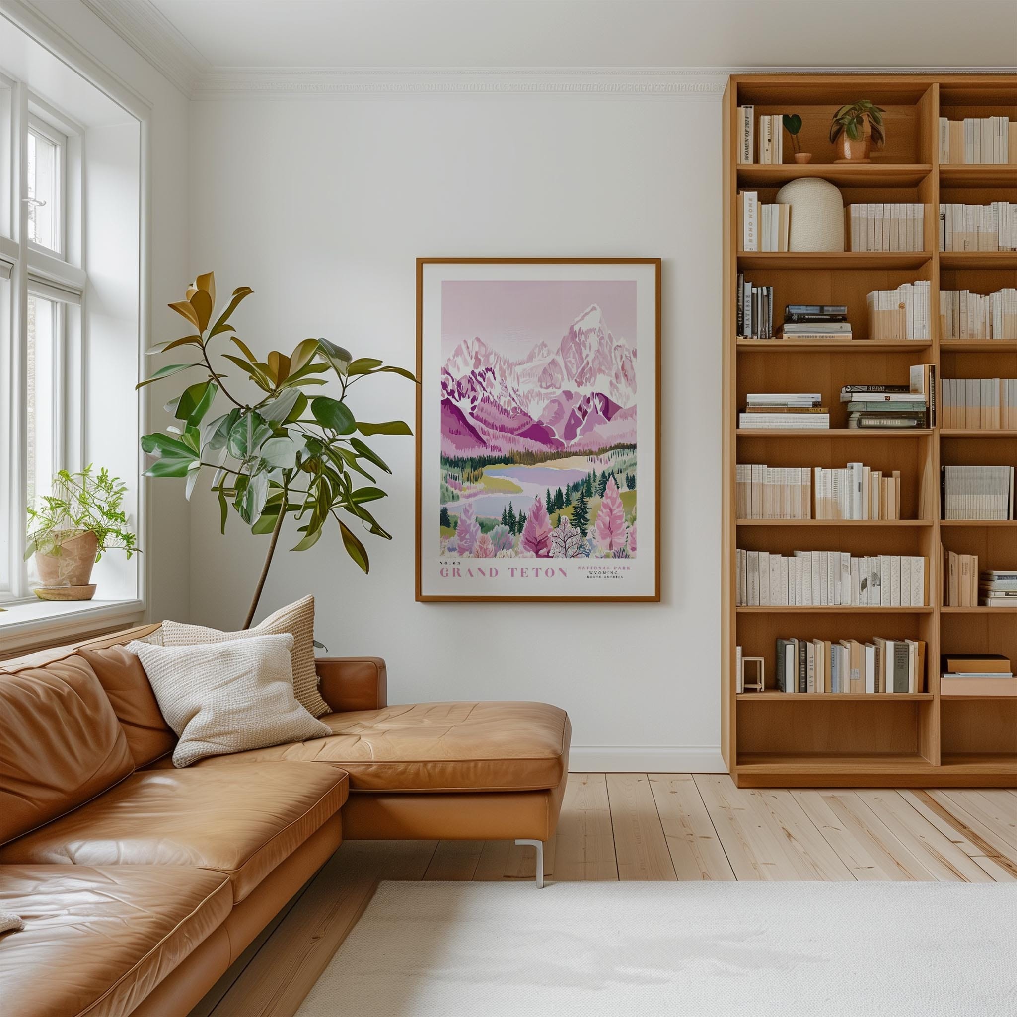 a cozy living room with a large window, a comfortable leather couch, a wooden bookshelf filled with books, and a framed poster of a mountain landscape hanging on the wall.