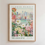 The image is a framed poster depicting a cityscape with a flower market in the foreground.