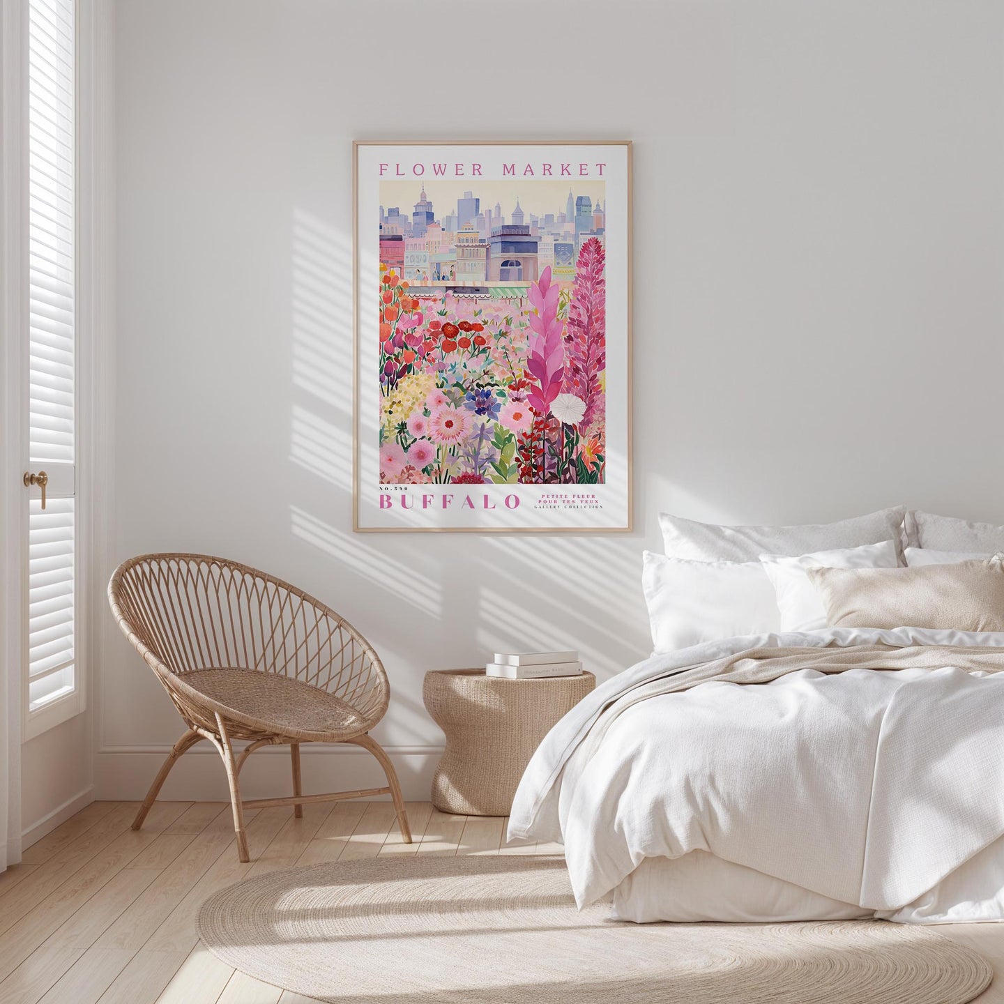 a bedroom with a bed, a wicker chair, and a framed poster of a flower market in Buffalo, New York.