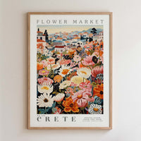 The image is a framed poster depicting a vibrant and colorful flower market in Crete, Greece.