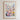 The image is a framed poster depicting a vibrant and colorful cityscape with a variety of flowers and plants in the foreground.