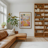 a cozy living room with a large bookshelf filled with books, a comfortable leather couch, and a large framed poster of a colorful floral scene hanging on the wall.