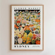 The image is a framed poster depicting a vibrant and colorful flower market in Sydney, Australia.