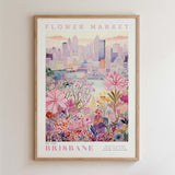 The image is a framed poster depicting a cityscape with a flower market in the foreground.