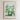 The image is a framed poster depicting a cityscape with a field of flowers in the foreground.