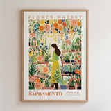 The image is a framed poster depicting a woman standing in a flower market, surrounded by various flowers and plants.