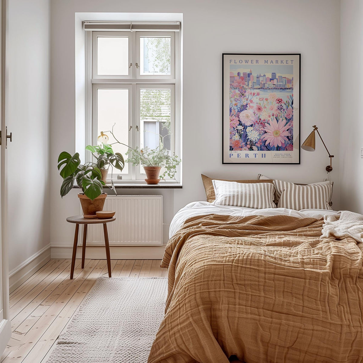 a cozy bedroom with a large bed, a nightstand with a potted plant, and a framed poster of a cityscape on the wall.