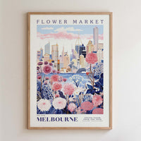The image is a framed poster depicting a cityscape with a flower market in the foreground.