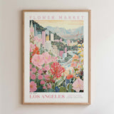 The image is a framed poster depicting a vibrant and colorful scene of a flower market in Los Angeles, California.