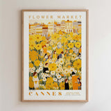The image is a framed poster depicting a flower market in Cannes, France.
