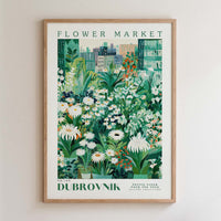 The image is a framed poster depicting a vibrant and lush flower market scene.