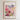 The image is a framed poster depicting a cityscape with a variety of colorful flowers in the foreground.