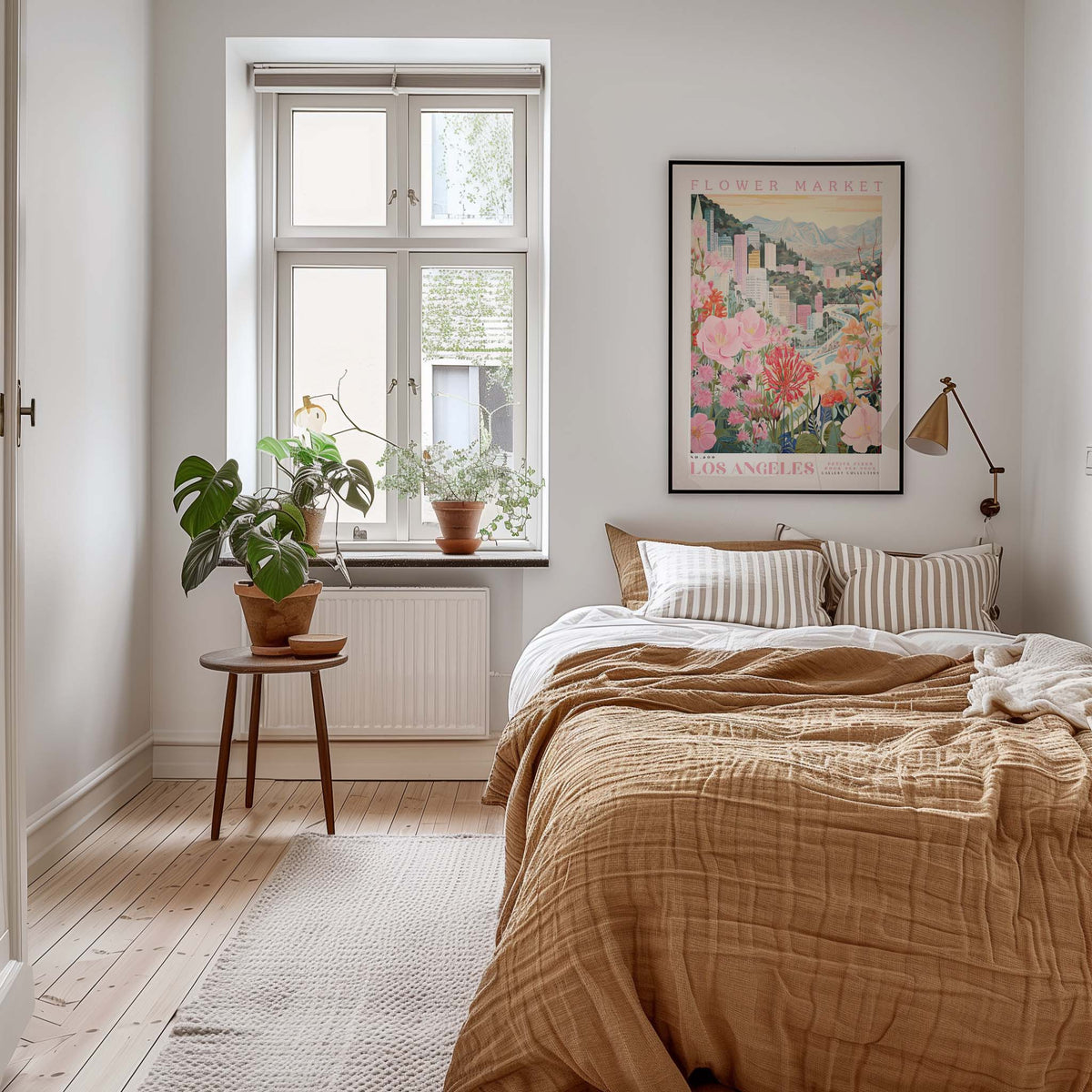 A cozy bedroom with a large bed, a nightstand with a plant, and a framed poster of a cityscape on the wall.