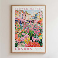 The image is a framed poster depicting a vibrant and colorful flower market in London.