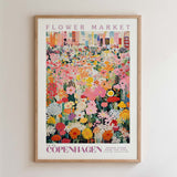 The image is a framed poster depicting a vibrant and colorful flower market in Copenhagen, Denmark.