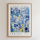 The image is a framed poster depicting a vibrant and colorful floral scene, with various types of flowers and plants arranged in a visually appealing manner.