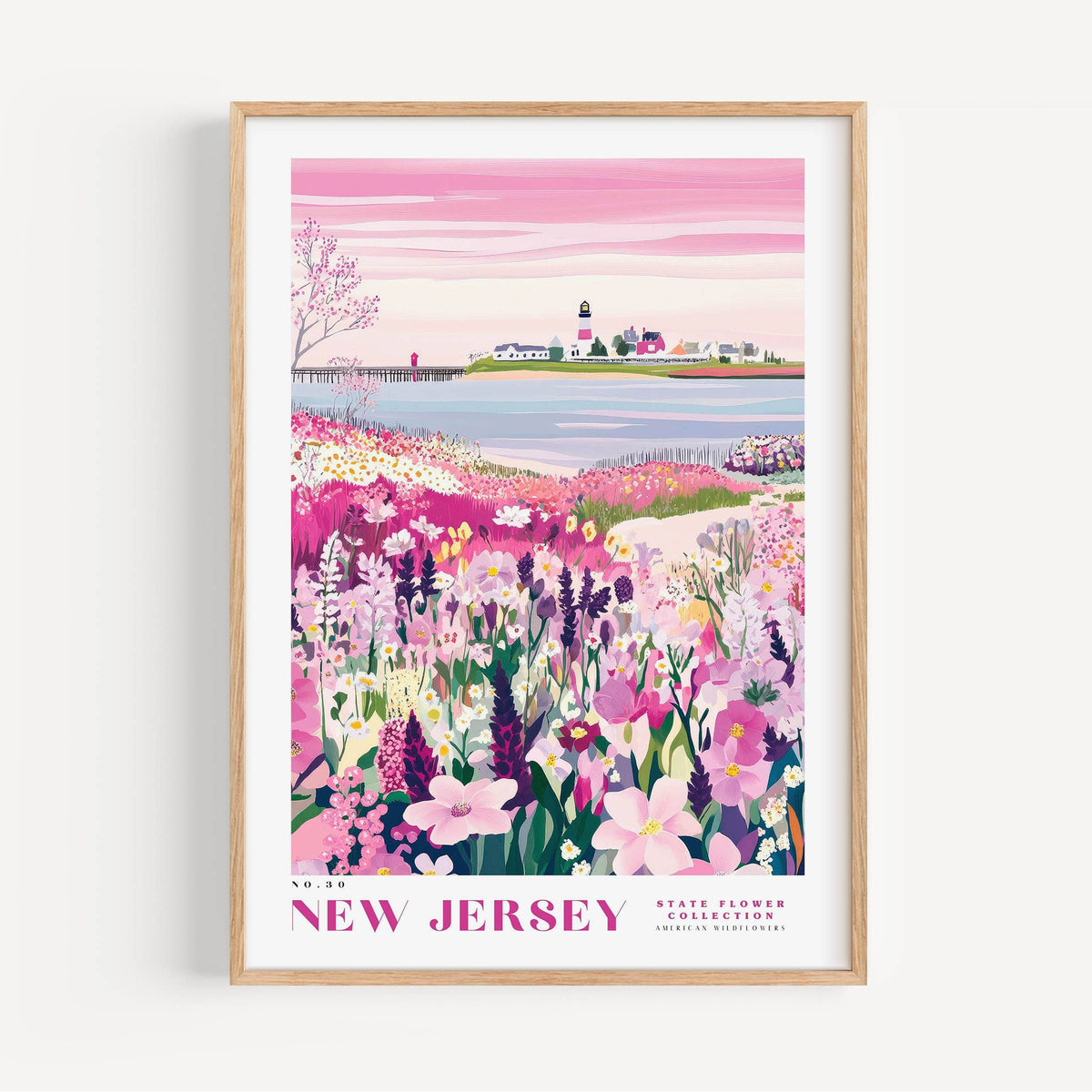 A framed poster depicting a scenic landscape with a lighthouse, a small town, and a field of colorful flowers.
