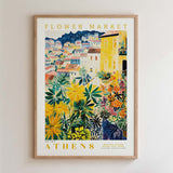 The image is a framed poster depicting a colorful and vibrant scene of a flower market in Athens, Greece.