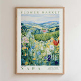 The image is a framed poster depicting a picturesque landscape with a flower market in Napa, California.