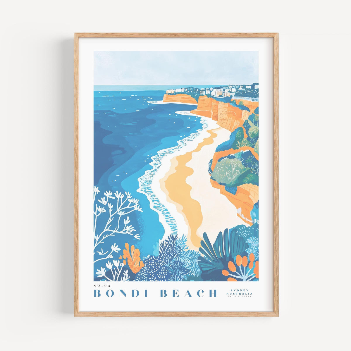 The image is a framed poster depicting a scenic coastal landscape with a beach, cliffs, and ocean.