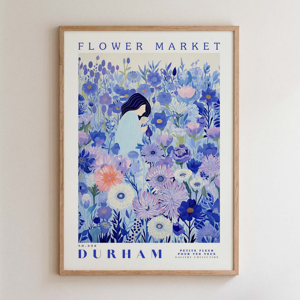 The image is a framed poster depicting a woman surrounded by a vibrant, colorful floral scene.