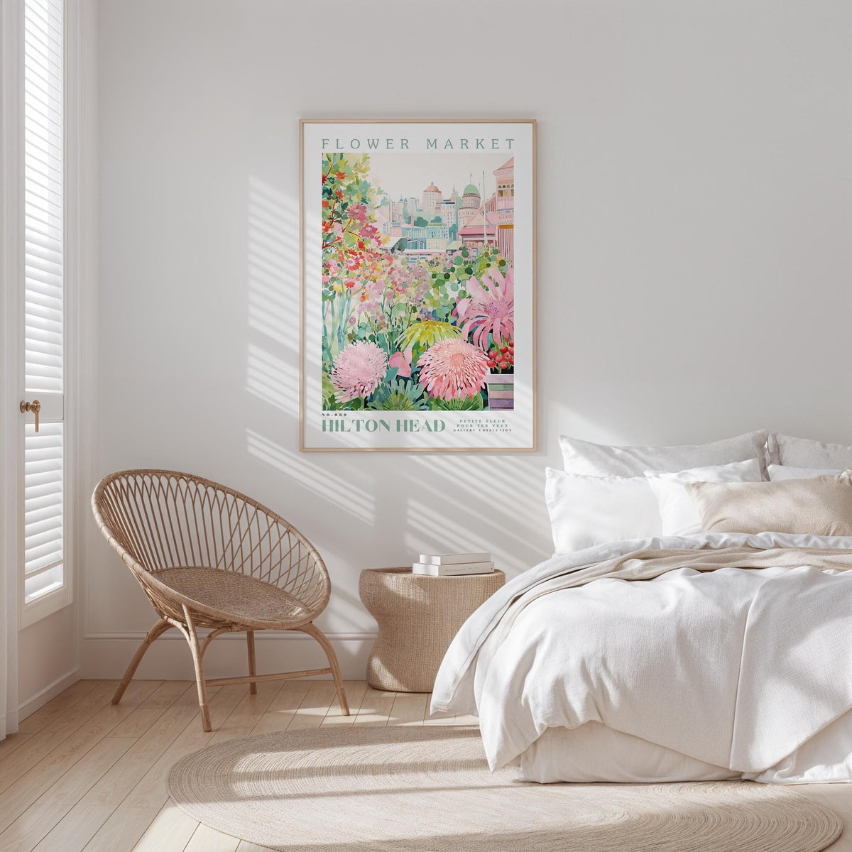 a serene bedroom scene with a bed, a woven chair, and a framed poster of a flower market.
