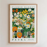 The image is a framed poster depicting a vibrant and colorful flower market.