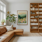 a cozy living room with a large window, a comfortable leather sofa, a wooden bookshelf filled with books, and a framed poster of a mountain landscape hanging on the wall.