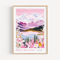 The image is a framed poster depicting a scenic landscape with mountains, a lake, and colorful flowers.