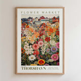 The image is a framed poster depicting a vibrant and colorful flower market.