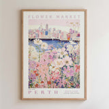The image is a framed poster depicting a cityscape with a flower market in the foreground.