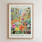 The image is a framed poster depicting a vibrant and colorful flower market scene.
