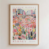 The image is a framed poster depicting a vibrant and colorful flower market in Sydney, Australia.