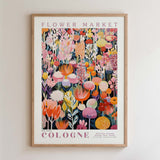 The image is a framed poster of a vibrant floral arrangement, featuring a variety of colorful flowers and plants.