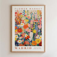 The image is a framed poster of a vibrant and colorful floral arrangement, depicting various flowers and plants in a lively and dynamic composition.