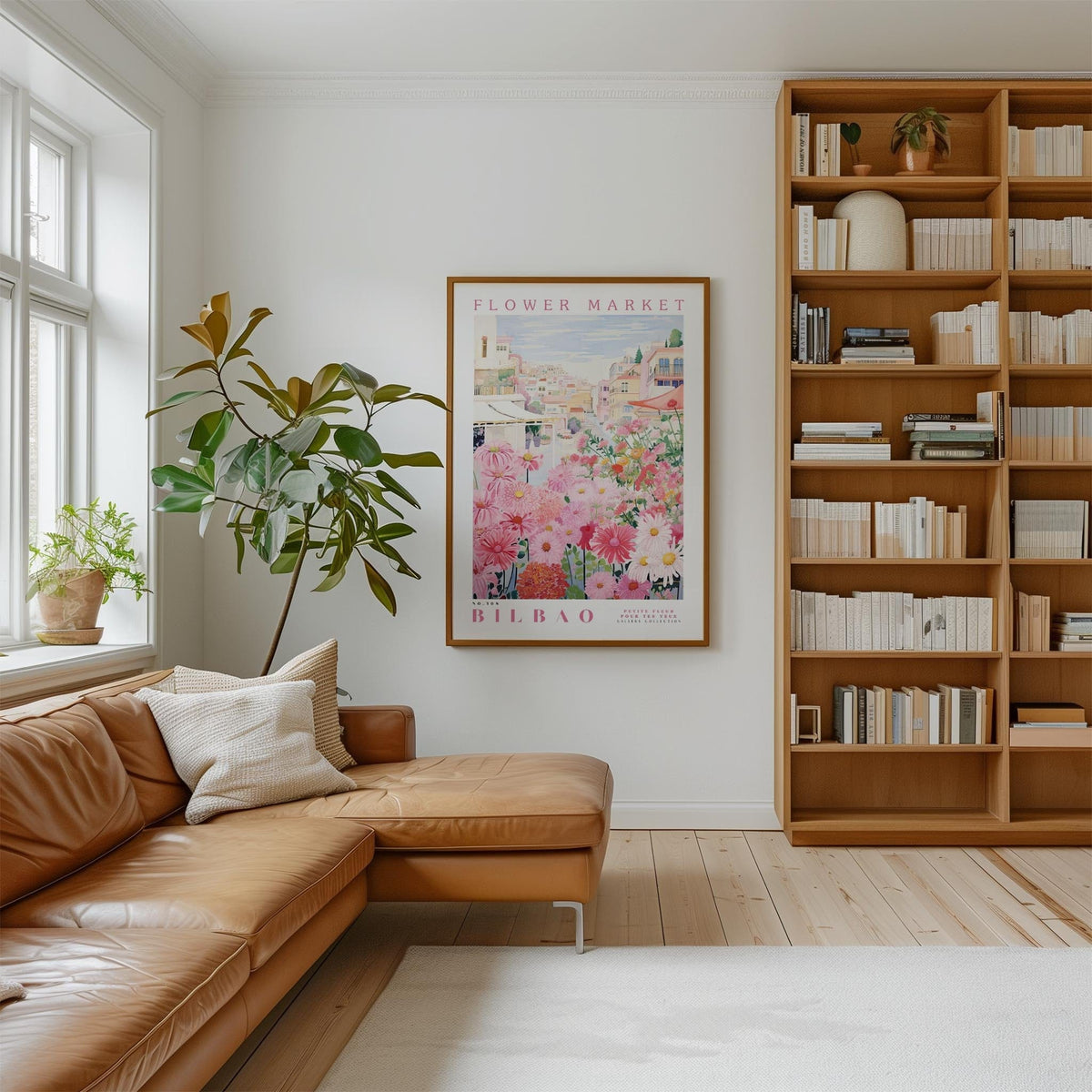 a cozy living room with a large window, a comfortable leather sofa, a wooden bookshelf filled with books, and a framed poster of a flower market hanging on the wall.