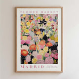 The image is a framed poster of a vibrant and colorful floral arrangement, likely from a flower market.