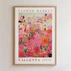 The image is a framed poster depicting a vibrant and colorful flower market in Valletta, Malta.