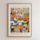 The image is a framed poster depicting a vibrant and colorful floral arrangement, with various types of flowers and foliage.