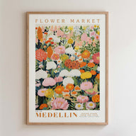 The image is a framed poster depicting a vibrant and colorful floral arrangement, with various types of flowers and foliage.