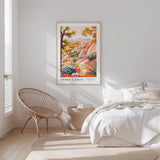 a serene bedroom scene with a large poster of a desert landscape hanging on the wall, a woven chair, and a neatly made bed with white bedding.
