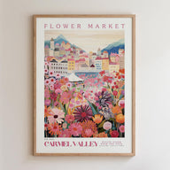 The image is a framed poster depicting a vibrant and colorful flower market in Carmel Valley, France.